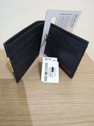 Cartera Rip Curl Negra y Amarilla