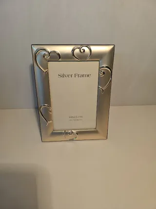 Cornice portafoto in metallo argentato nuova