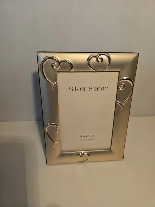 Cornice portafoto in metallo argentato nuova