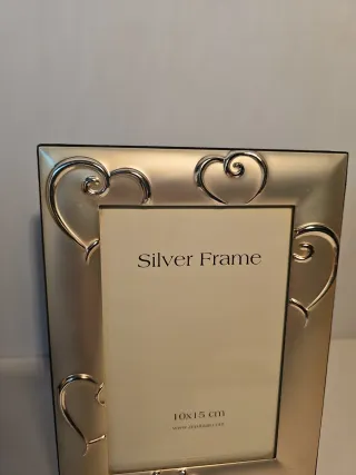 Cornice portafoto in metallo argentato nuova
