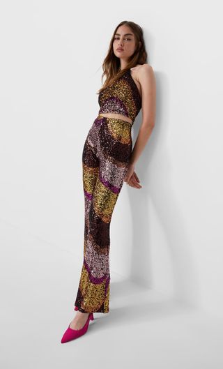 Conjunto lentejuelas crop top y pantalón flare