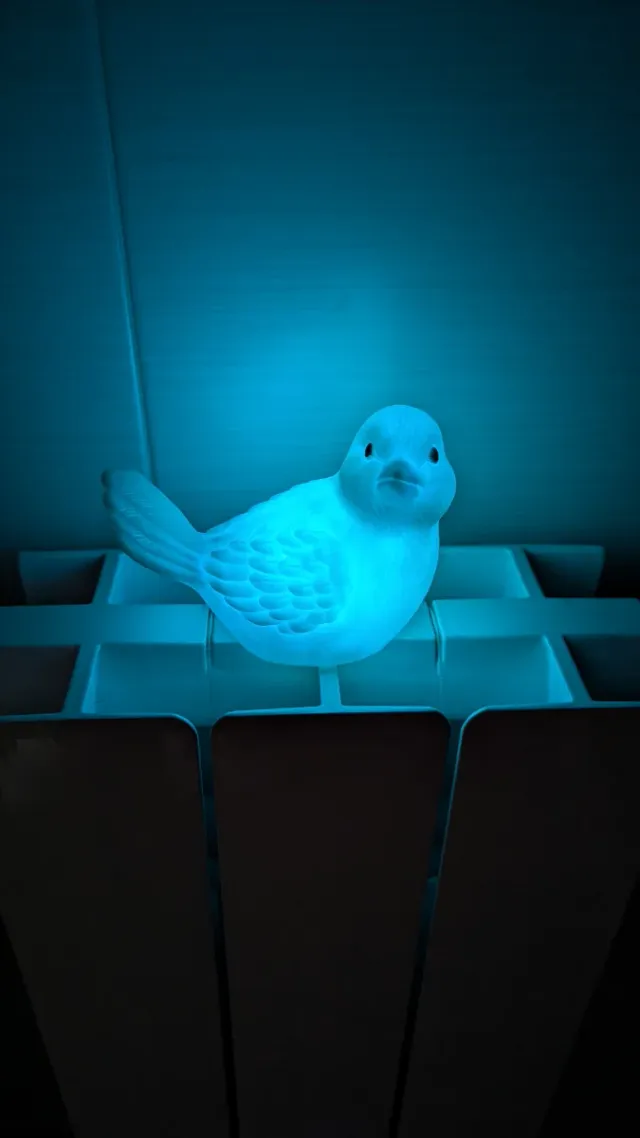 Lámpara pájaro cambia color