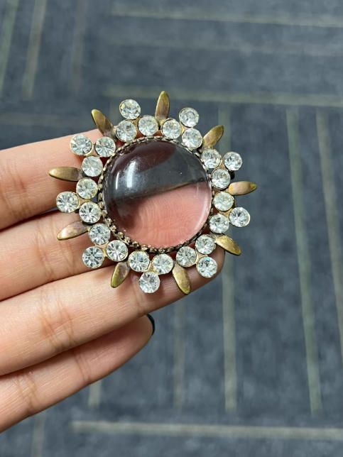 Broche sol con piedras