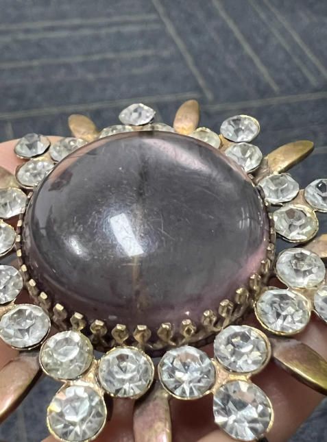 Broche sol con piedras