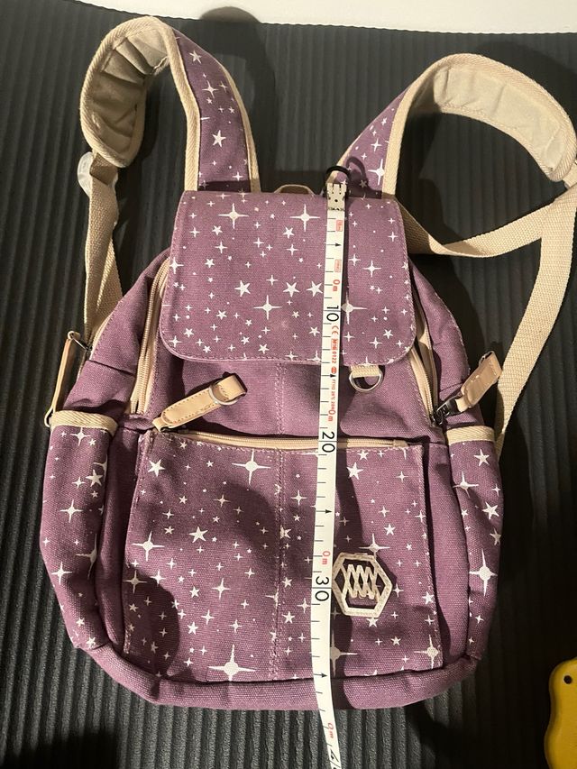 Zaino viola con stelle bianche
