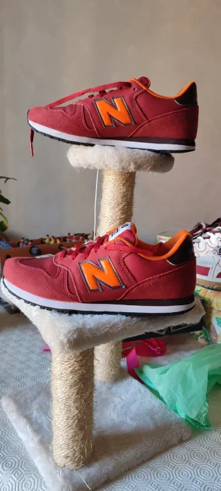 Scarpe New Balance 373 rosse e arancioni