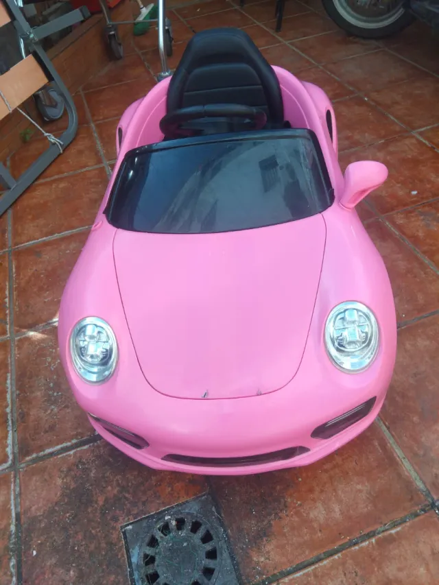 Coche eléctrico infantil rosa con mando