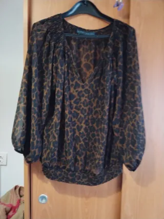 Blusa animal print manga larga