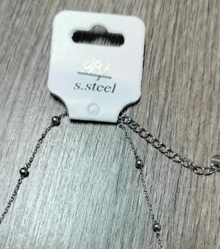 Collana in acciaio con cornetto rosso e cuori