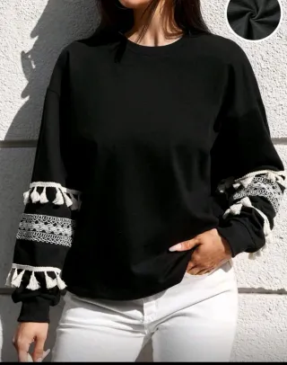 Jersey negro con flecos y encaje