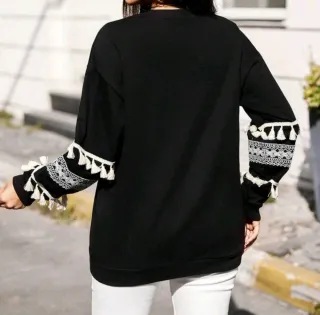 Jersey negro con flecos y encaje