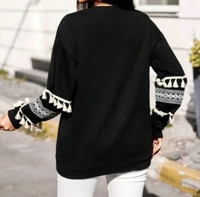 Jersey negro con flecos y encaje