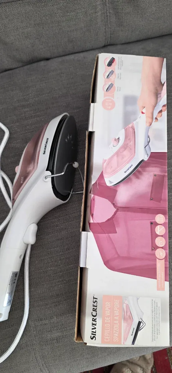 Plancha de vapor vertical rosa y blanca