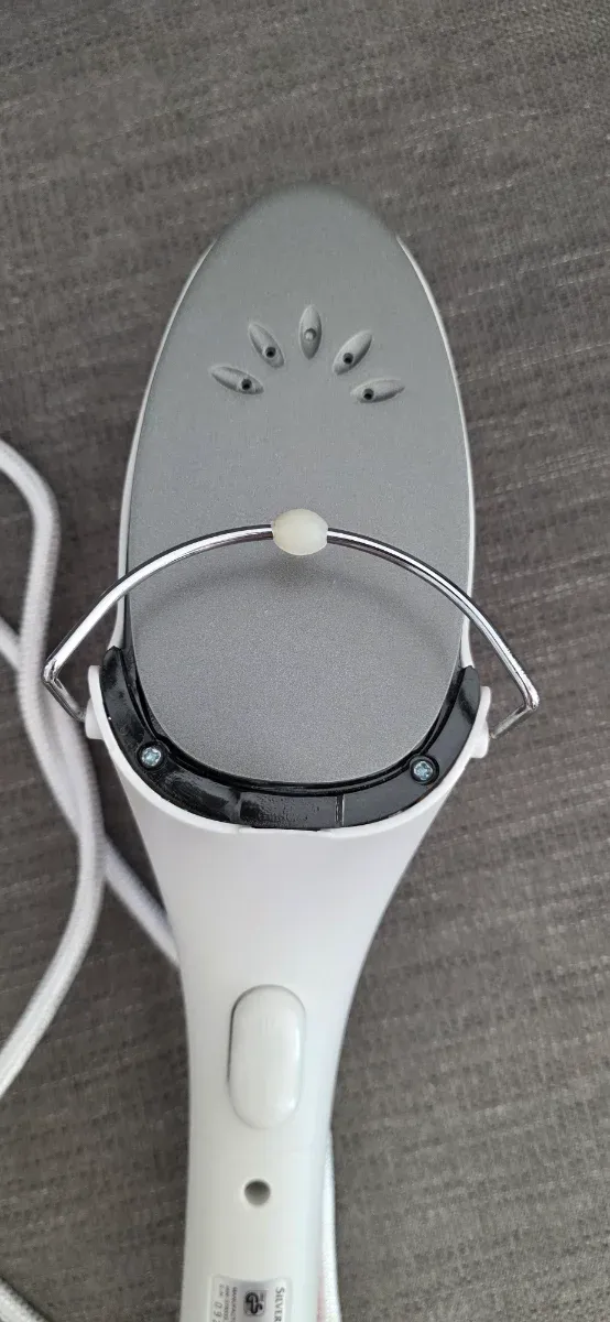 Plancha de vapor vertical rosa y blanca