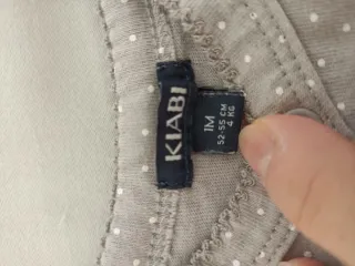 Tutina neonata grigia pois