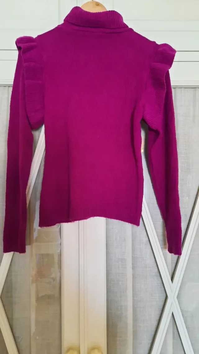 Chaleco rosa  T.M volante en hombro. Rosa favorece