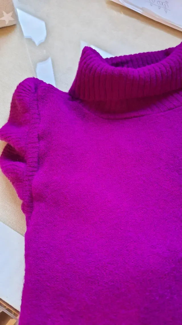 Chaleco rosa  T.M volante en hombro. Rosa favorece