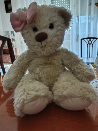 Orsacchiotto peluche con fiocco rosa
