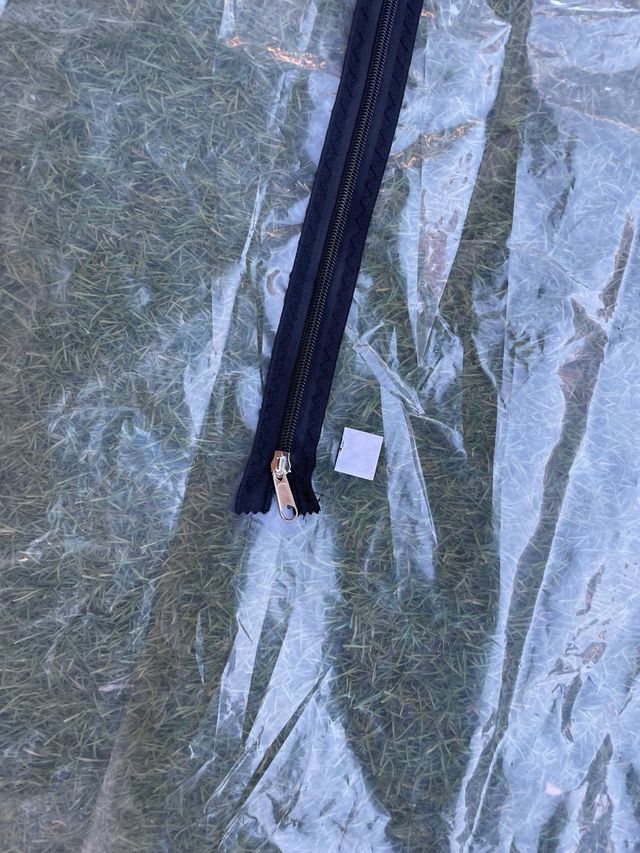 Puerta con cremallera para protección contra polvo