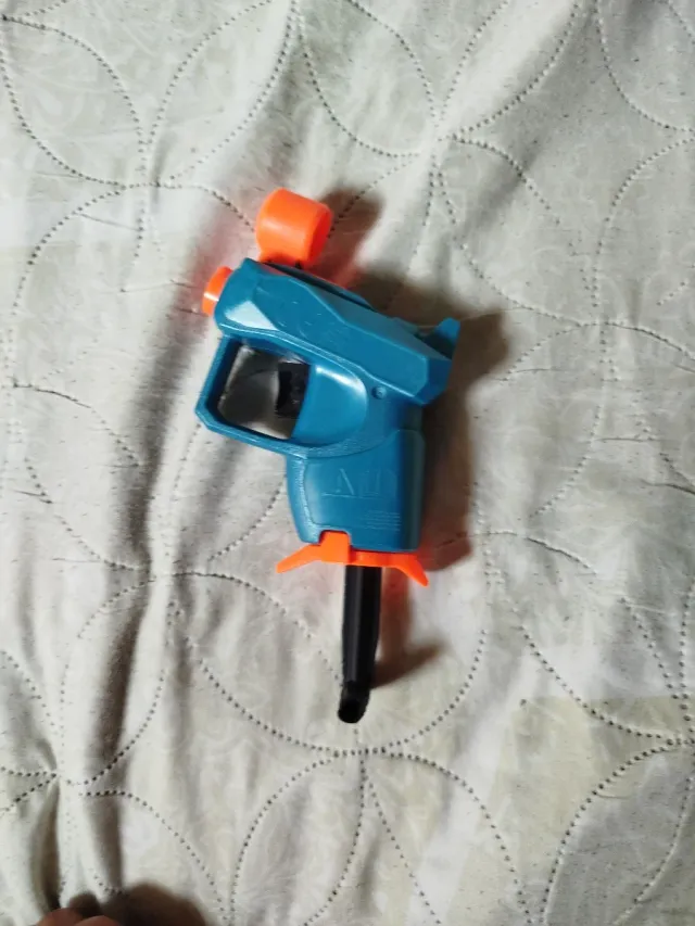 Mini pistola Nerf azul y naranja