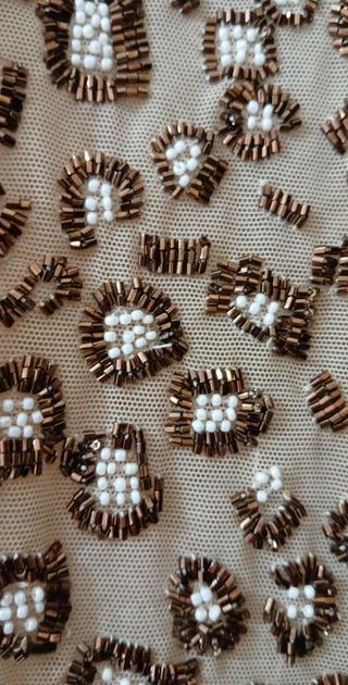 Top con paillettes beige e oro