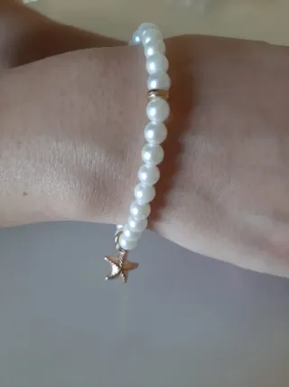 Bracciale perla con stella marina dorata