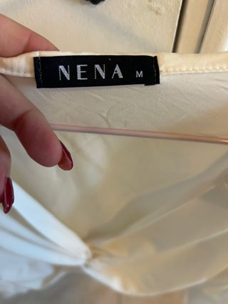 Blusa blanca cruzada con nudo