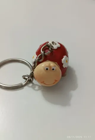 Portachiavi coccinella rossa con fiori