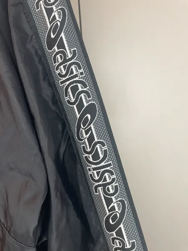 ASICS vintage giacca a vento nero impermeabile