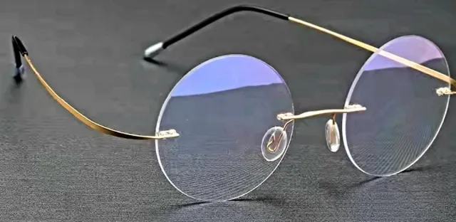 Gafas redondas sin montura doradas