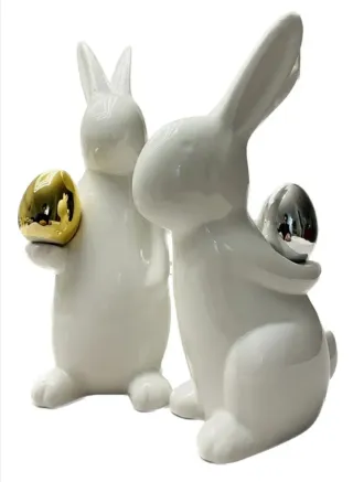 Juego 2 conejos Pascua porcelana huevos oro plata.