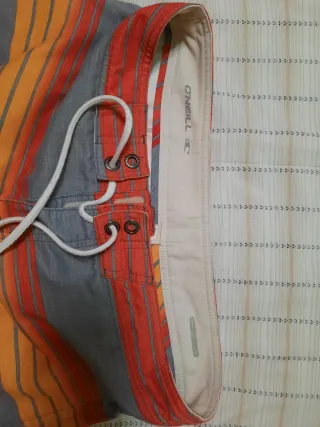 Bañador O'Neill rayas gris y naranja