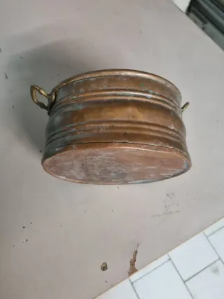 Pentola in rame con manici