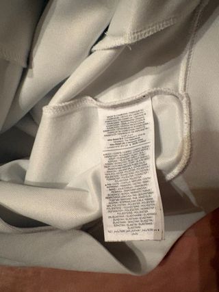 Giacca Nike bianca con dettagli rosa