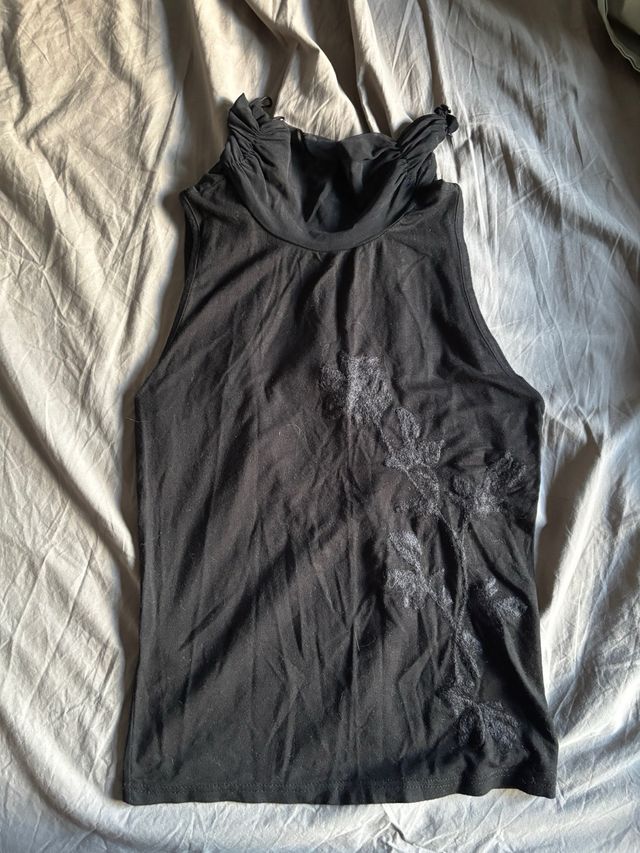 Top sin mangas cuello alto vintage