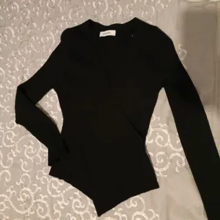 Jersey Tintoretto negro cruzado