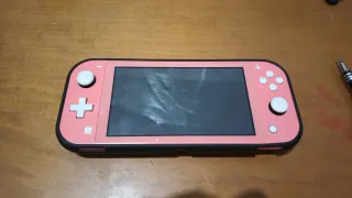 Nintendo Switch Lite Rosa +Funda+ zócalo a reparar