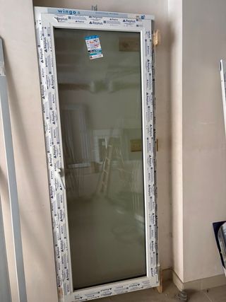 Puerta PVC con cristal nueva