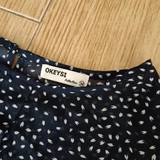 Blusa Okeysi manga corta estampada azul marino