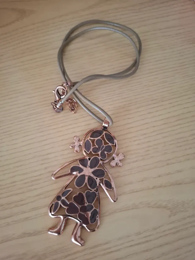 Colgante muñeca acero rosa y cuero