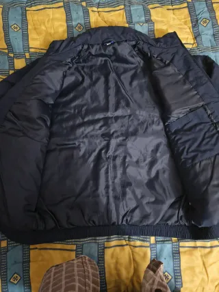 Giubbino Asics blu e bianca