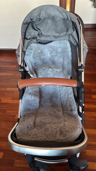 Cochecito de bebé y capazo gris y cuna