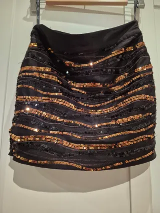 Falda corta lentejuelas negras y doradas/marròn.