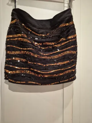 Falda corta lentejuelas negras y doradas/marròn.