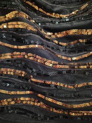 Falda corta lentejuelas negras y doradas/marròn.