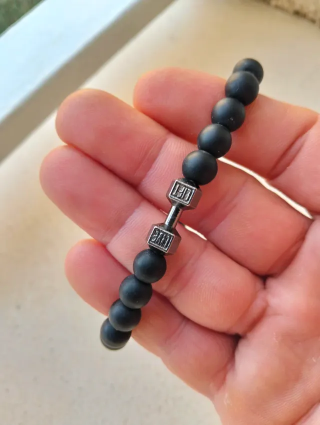 Pulsera negra diseño mancuerna