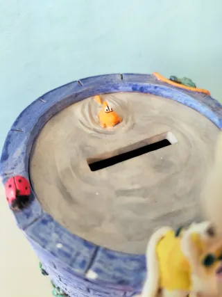 Salvadanaio con Diddl e Diddlina su pozzo desideri