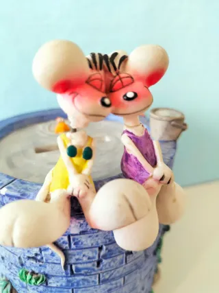 Salvadanaio con Diddl e Diddlina su pozzo desideri