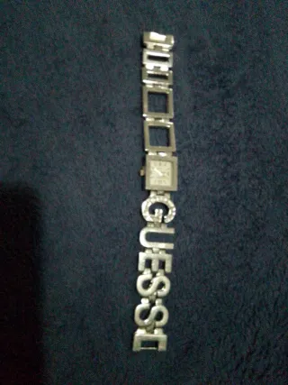 Reloj Guess y pendientes varios
