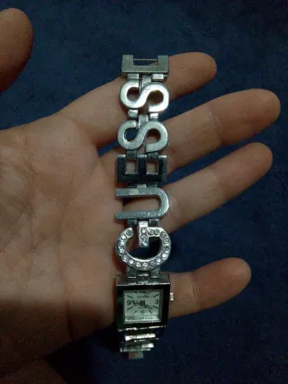Reloj Guess y pendientes varios